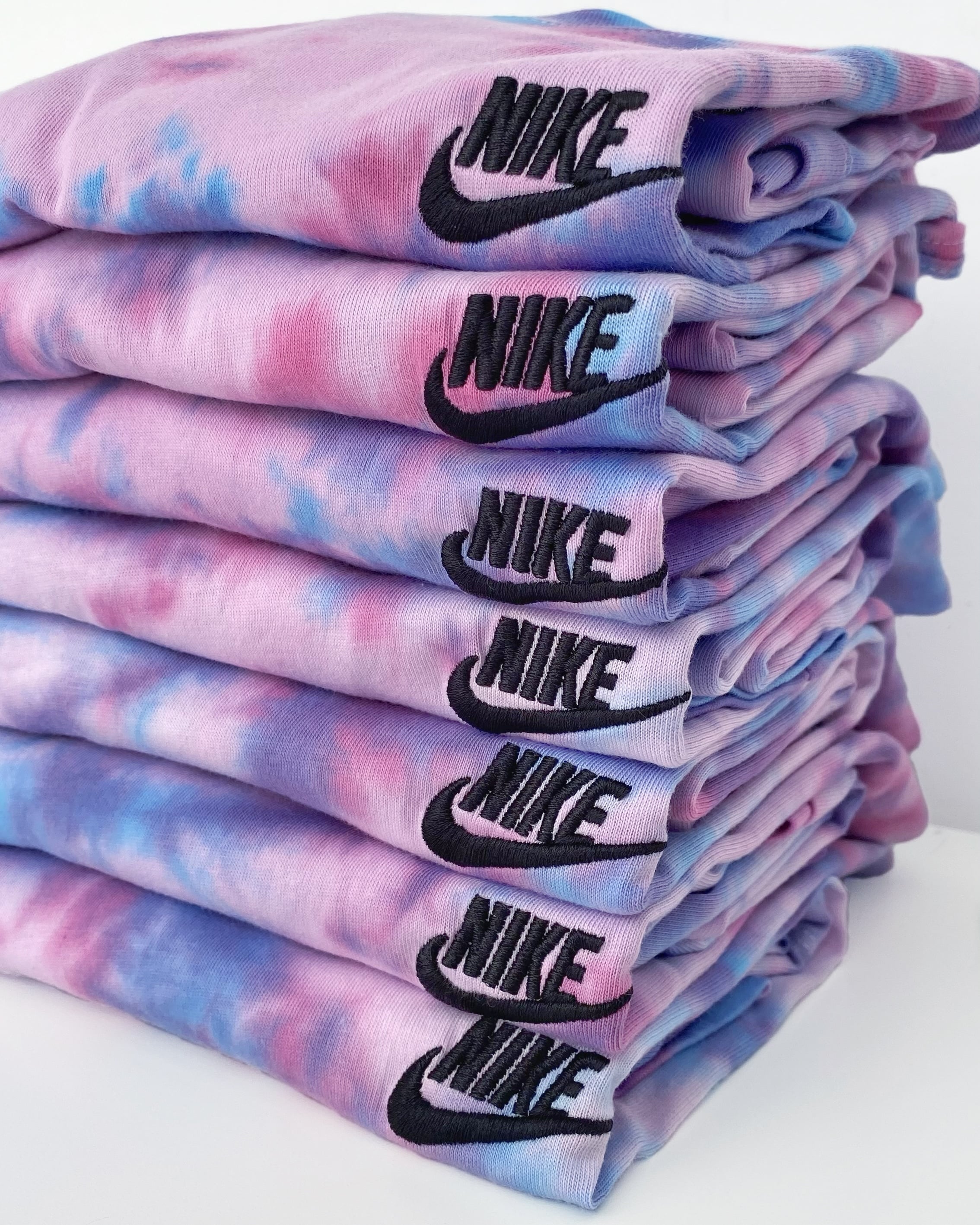 Upgrade your style with our hand-dyed, 100% authentic Unicorn tie dye Nike tee. Classic fit for comfort.