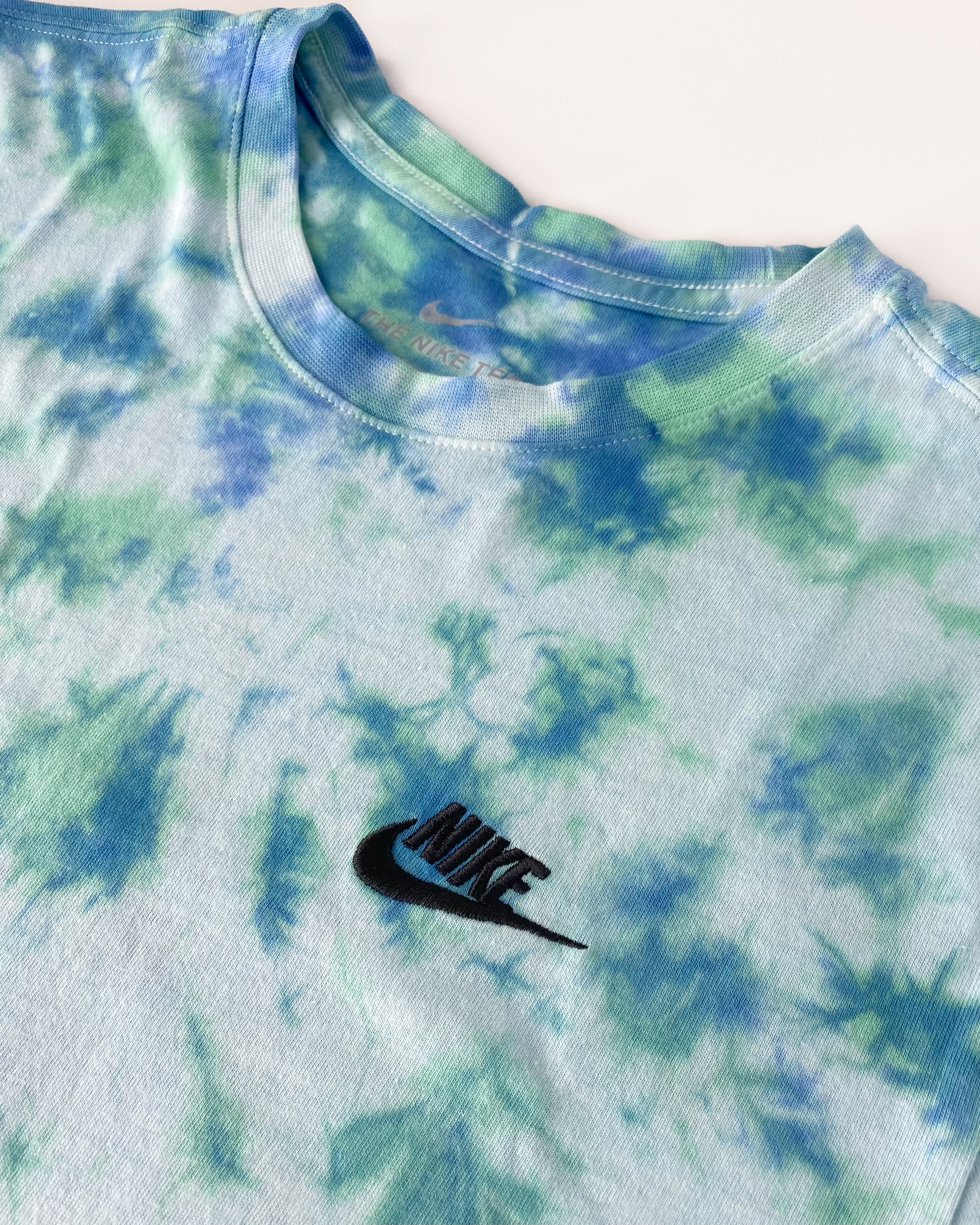 Vibrant mix colors Tulip tie dye on a classic fit Nike t-shirt.