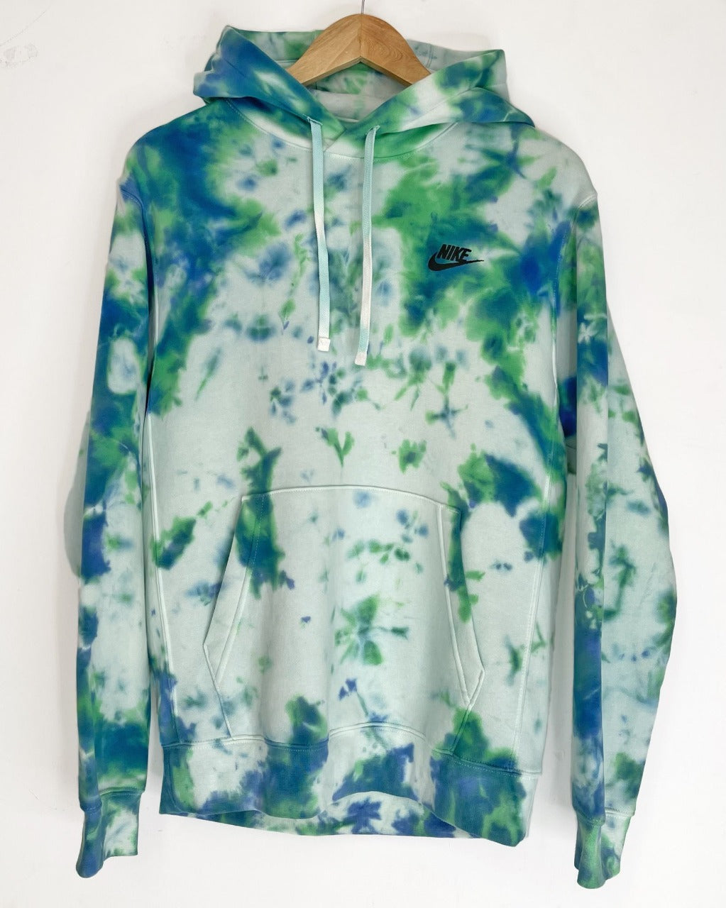 Unique Tulip Tie Dye pattern on a comfy and authentic Nike hoodie.