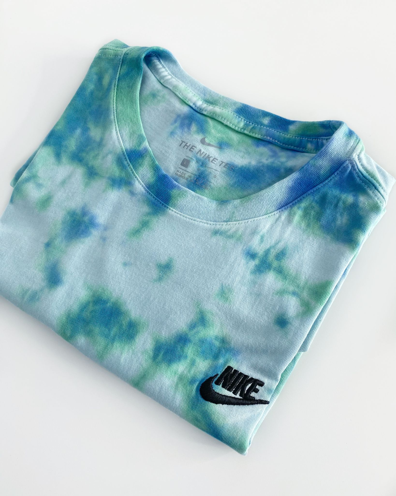 Unique hand-dyed Tulip tie dye Nike tee with a relaxed, easy feel.
