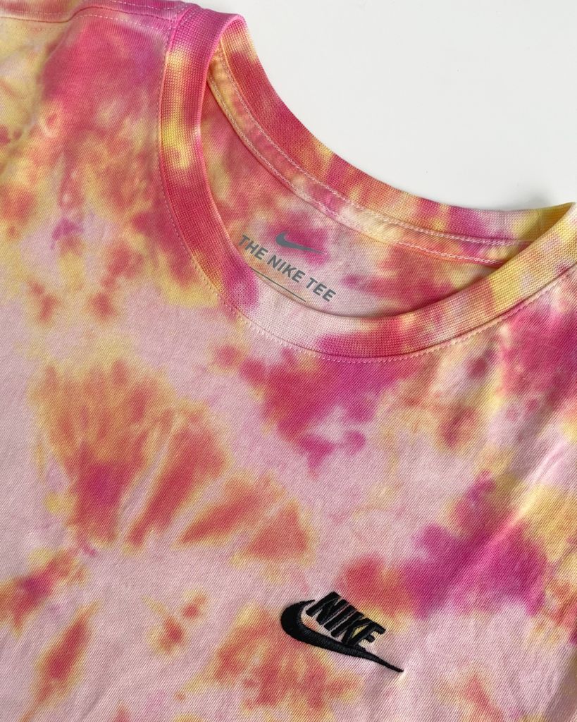 Nike tee with pink, yellow and orange tie-dye pattern from the Colour Trip collection